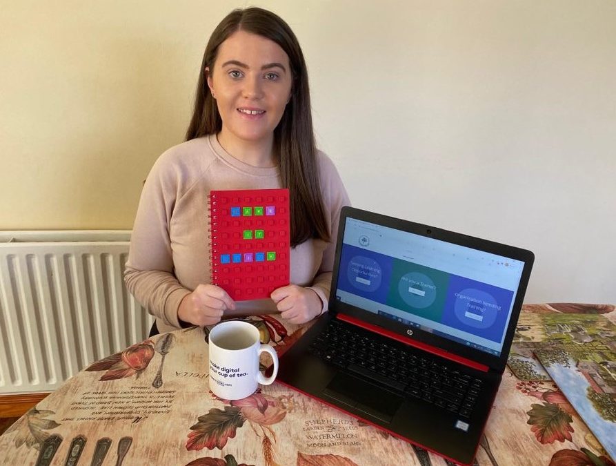 Marketing Trainee Frances from St Mary's University College on placement with Training Matchmaker pictured with Make It Click workbook